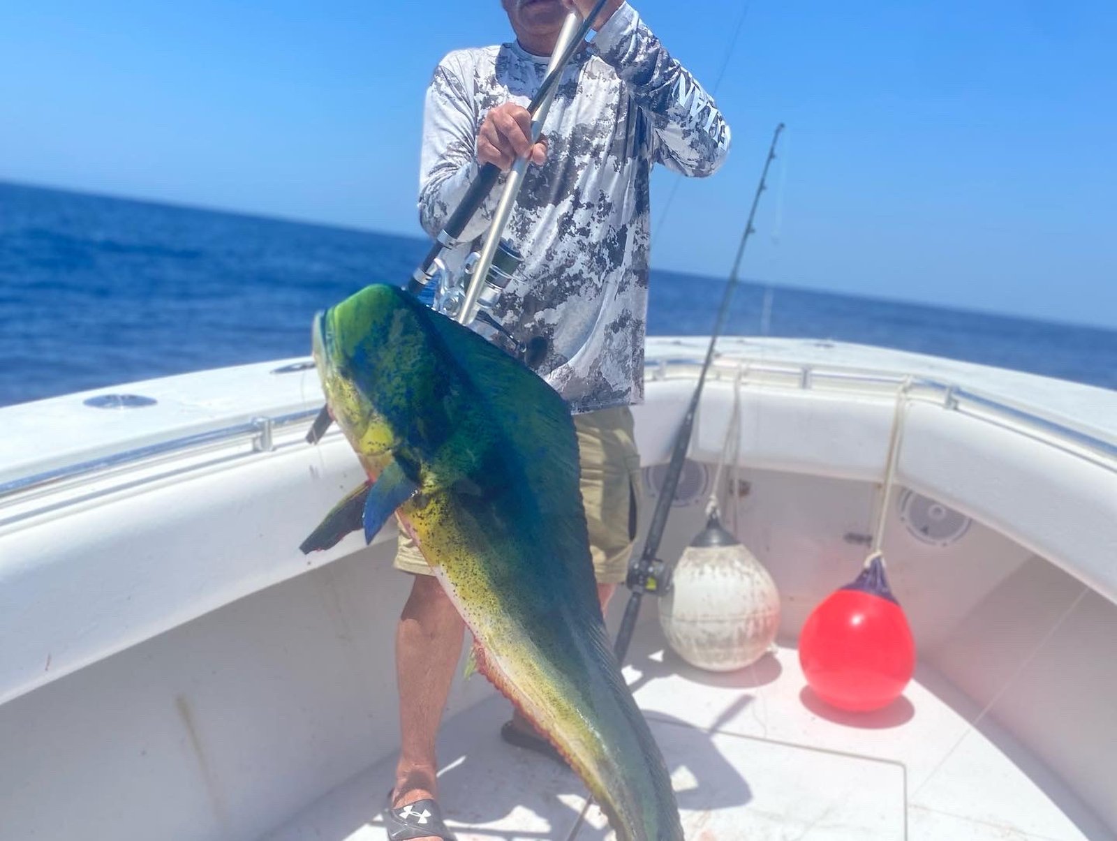 Bright green and blue mahi mahi landed during a full-day offshore charter
